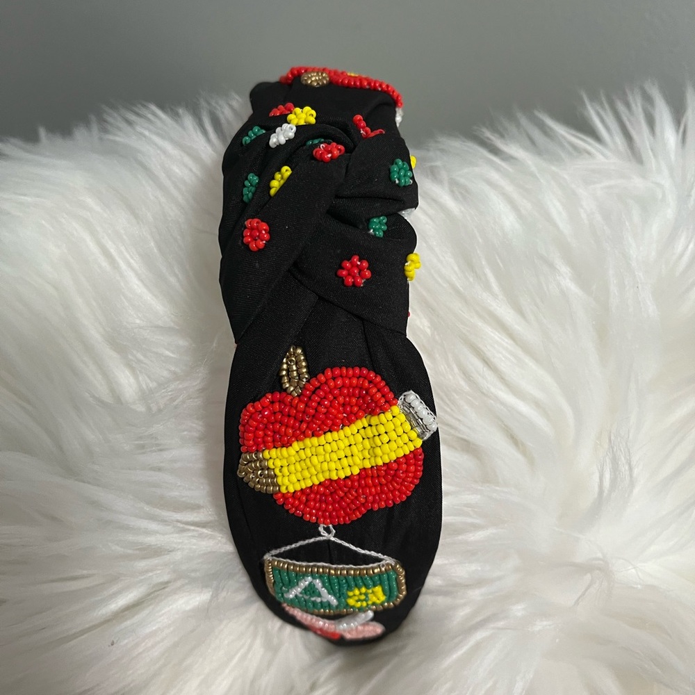 Teacher sees beaded headbands